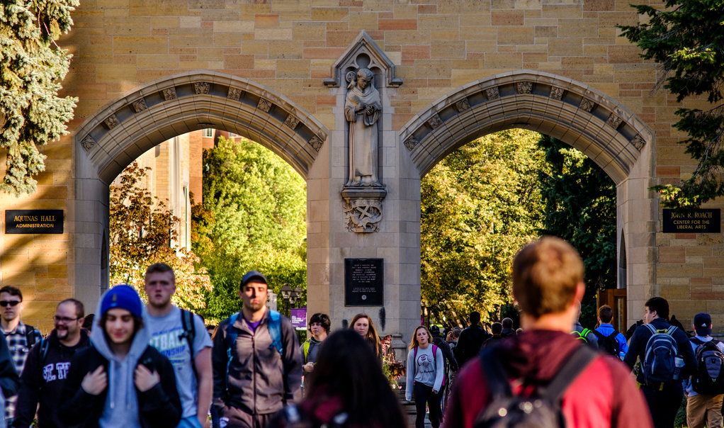 Students walk through the arches daily