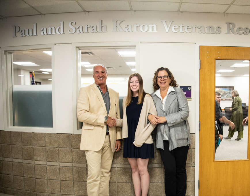 Paul and Sarah Karon stand with Anna Sauter outside of the newly dedicated Paul and Sarah Karon Veterans Resource Center