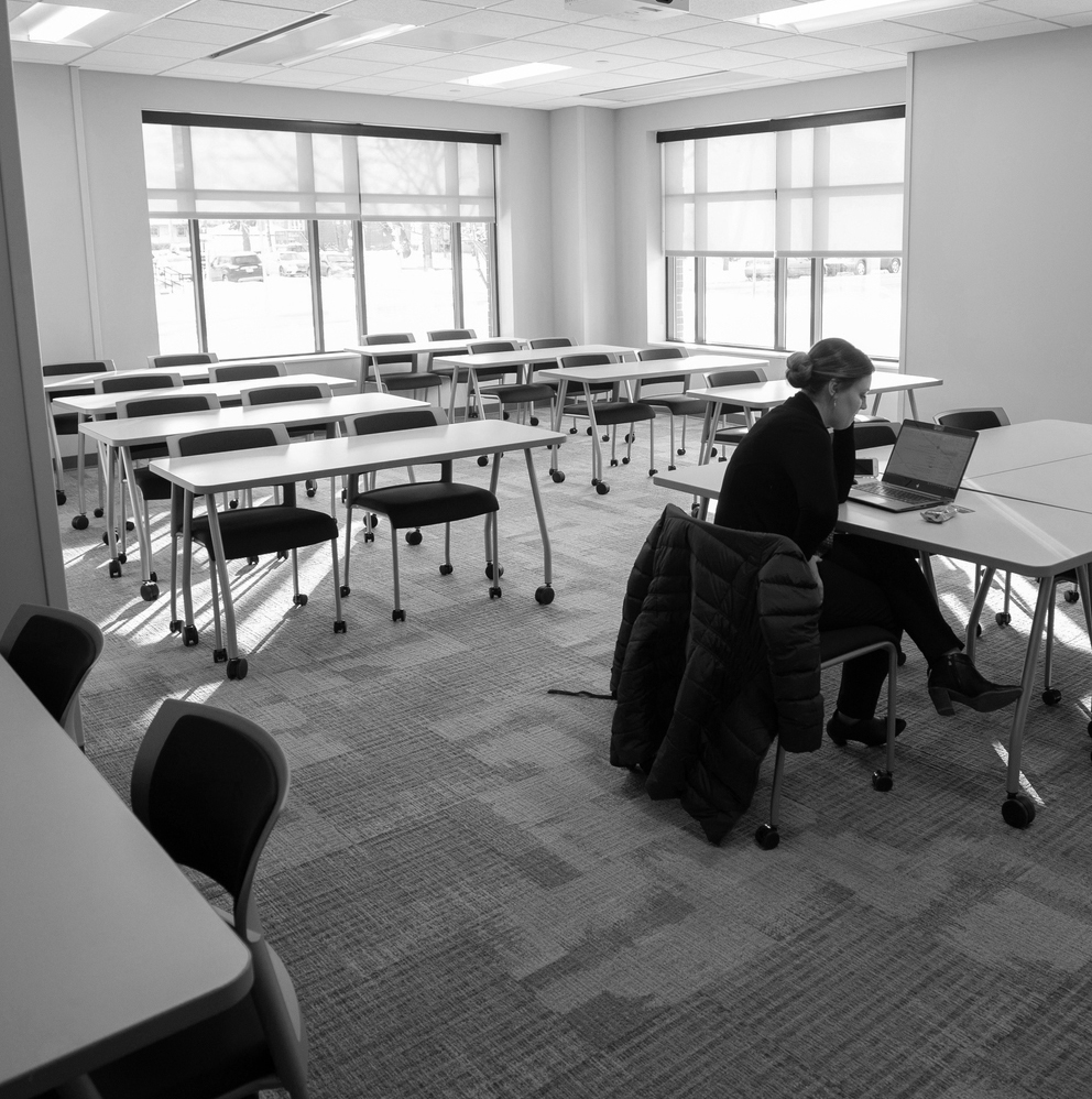 student sits alone in a room in McNeeley Hall