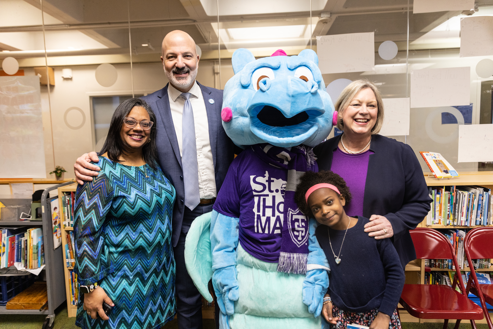 SPPS Superintendent Dr. Joe Gothard, Maxfield Principal Dr. Leslie Hitchens and School of Education Dean Amy Smith, Anna McCulloch and daughter Nelly pose after announcement that Saint Paul Public School Maxfield Elementary has been named a Collaborative Learning School
