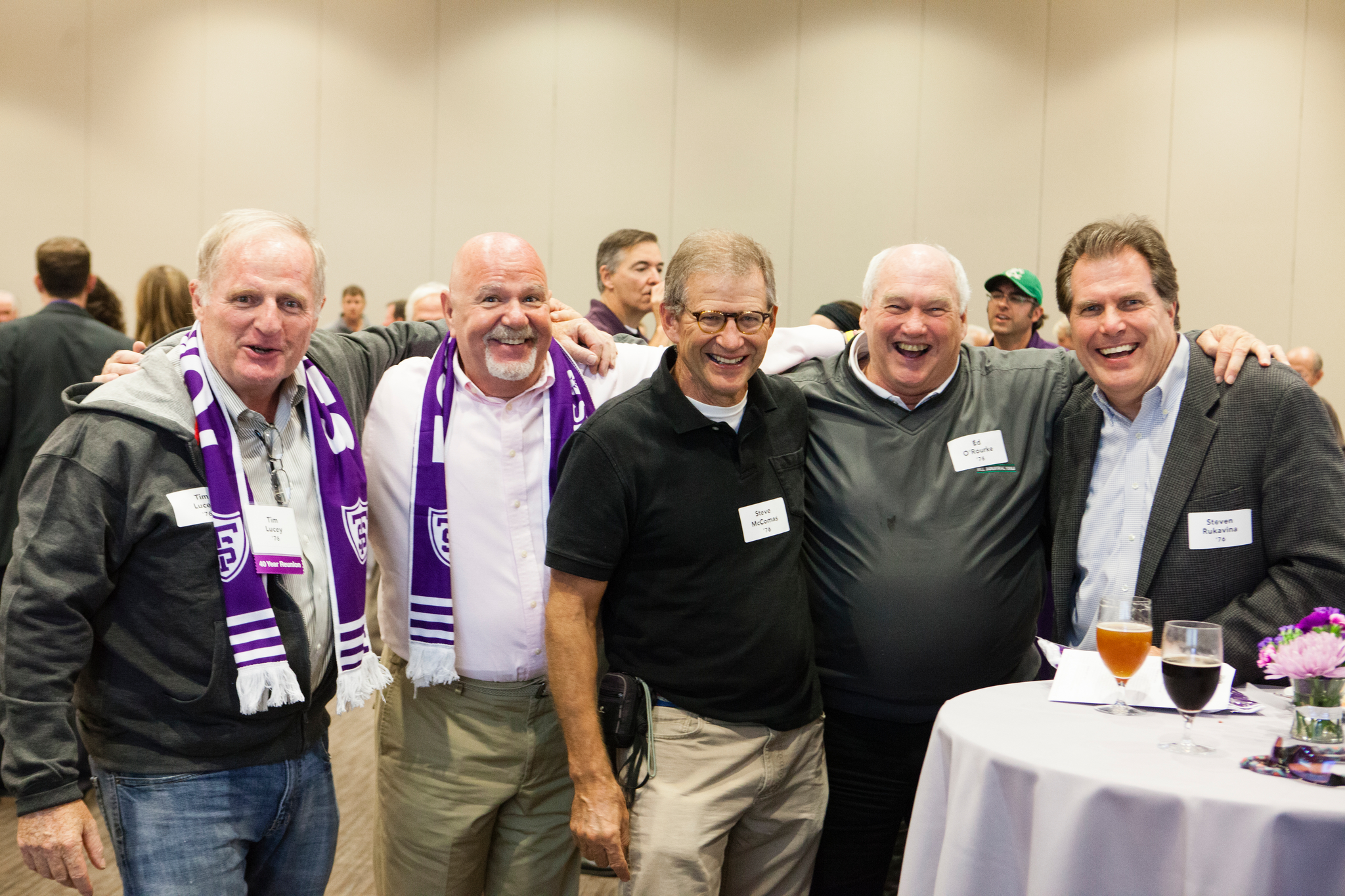 a group of men pose for a photo at their 50-year class reunion