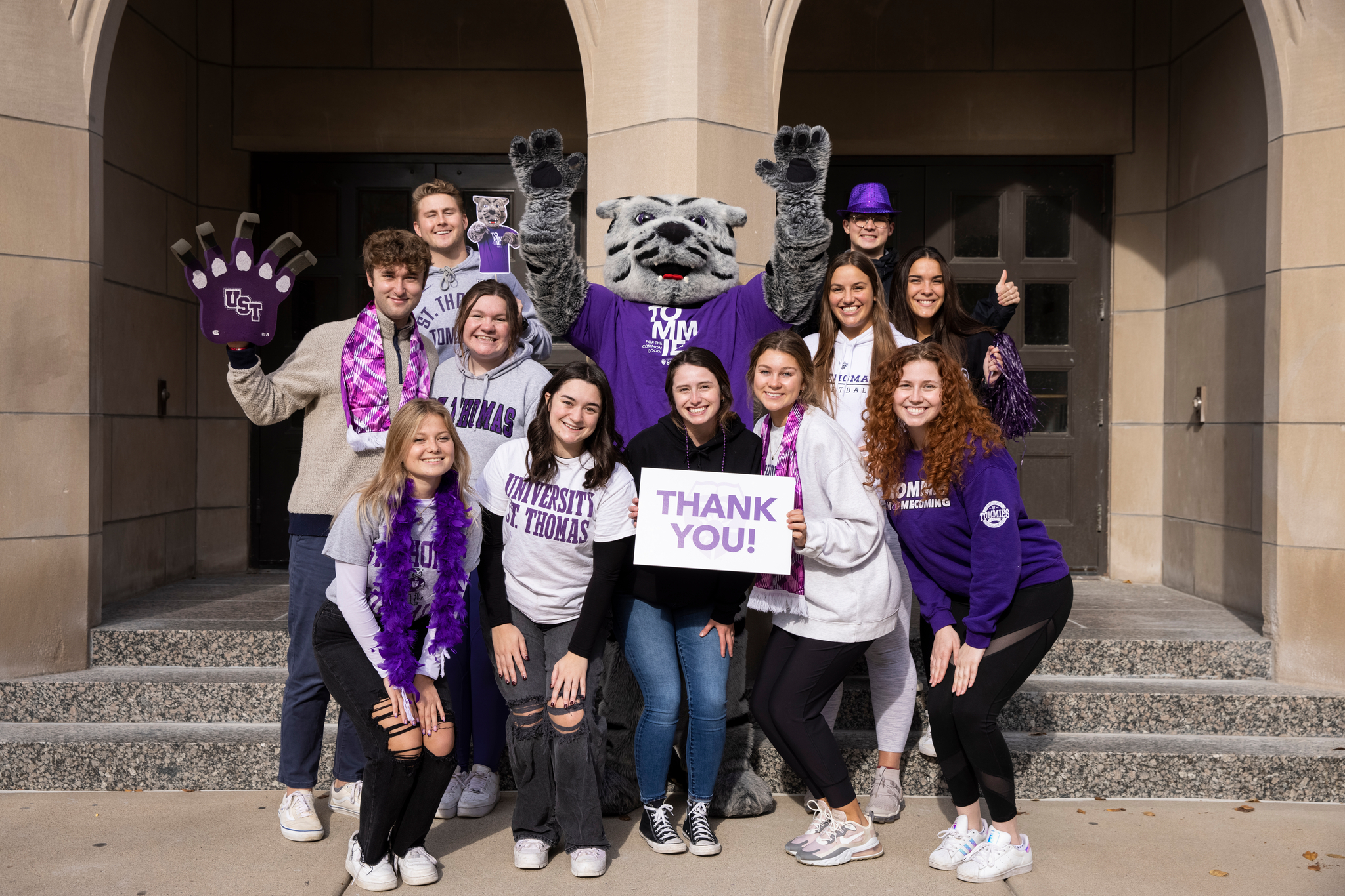 Tommie and student employees of the Engagement Center stand together for a group photo 