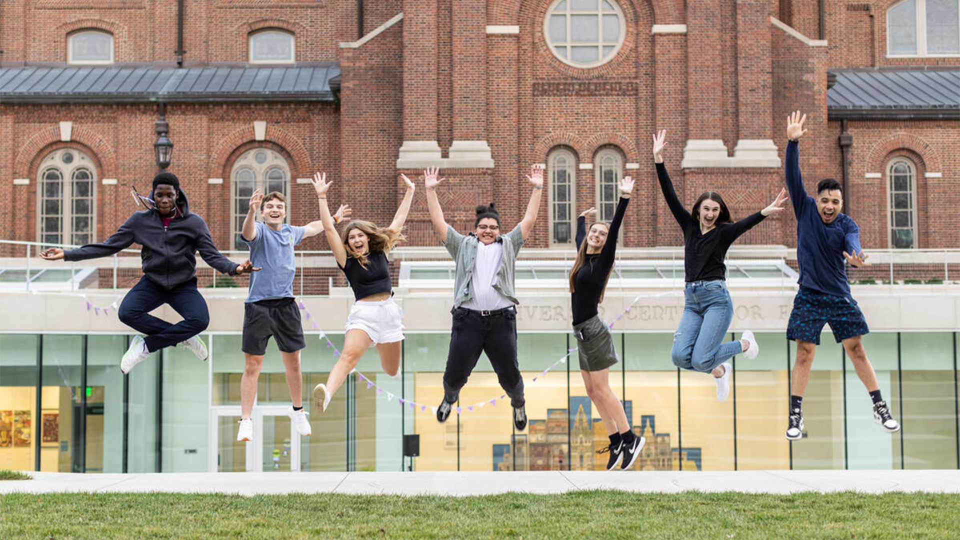 Students jumping to say thank you to donors