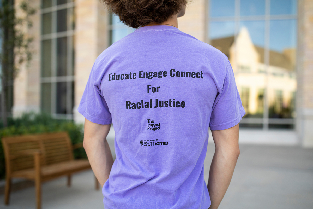 impact project student wearing racial justice shirt