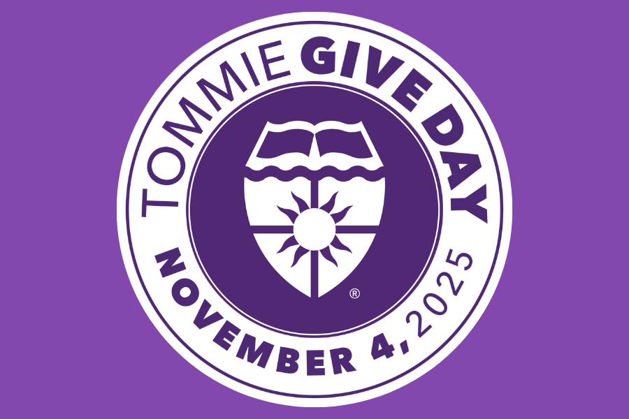 Round Tommie Give Day logo with University of St. Thomas academic shield in center. 