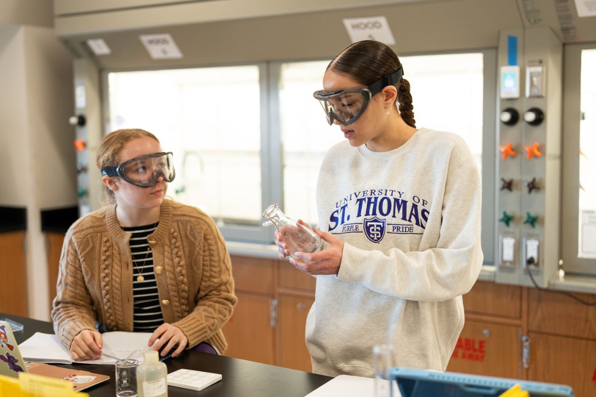 Students with safety goggles in the chemistry lab in Schoenecker Hall