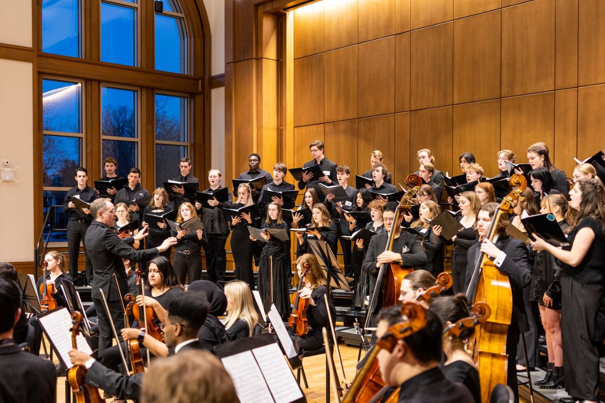 Student choir and orchestra in the Performance Hall of the Schoenecker Center