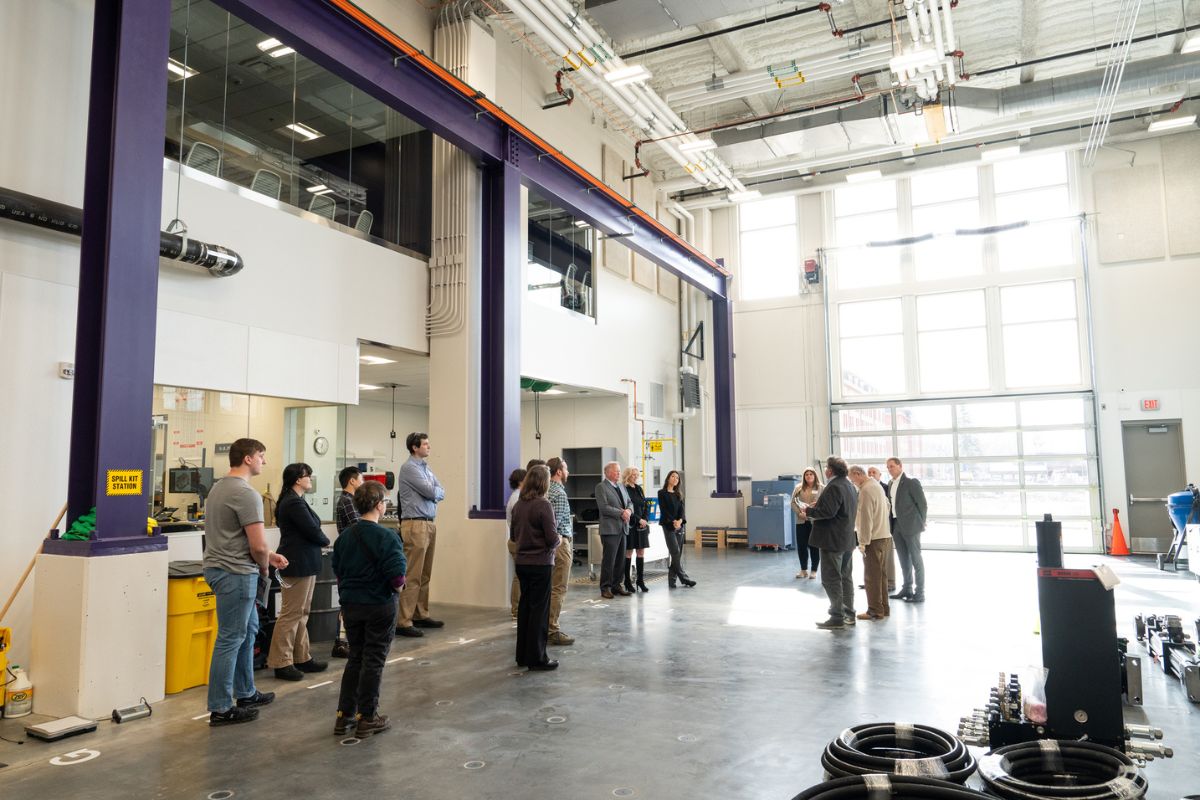 People gather in the High Bay in the Schoenecker Center