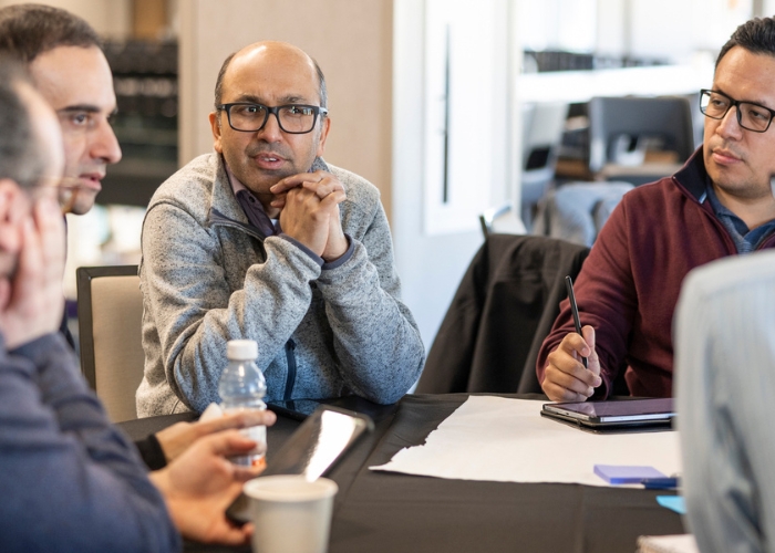 Professors have a discussion over scientific papers 