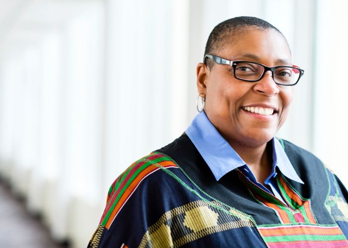 Founding associate dean of the Dougherty Family College Buffy Smith poses for a portrait in the skyway between Terrence Murphy Hall and Opus Hall November 29, 2016.
