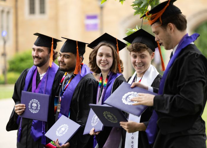 Students smile during Undergraduate Commencement
