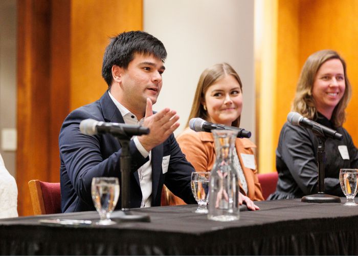 Law students on a panel discussion