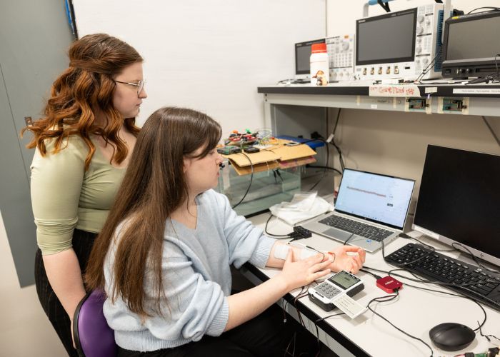 Electrical engineering students work in a lab