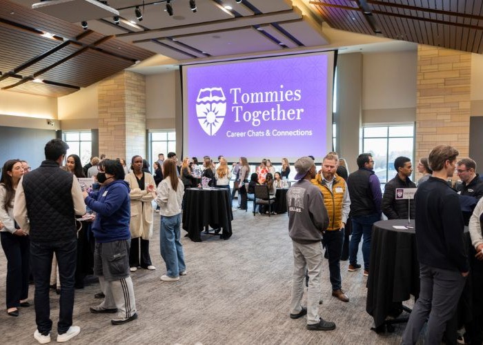Alumni and students have conversations with each other during Tommies Together event