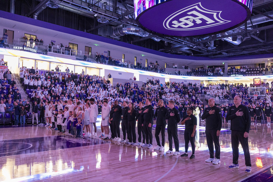Basketball team on the court at the Lee & Penny Anderson Arena