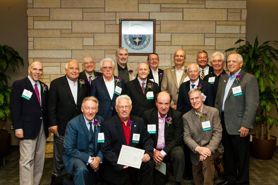 2016 inductees of the old guard pose for a photo at the Old Guard Reunion and Induction Ceremony outside the Hearth Room of ASC on Friday, September 30, 2016.