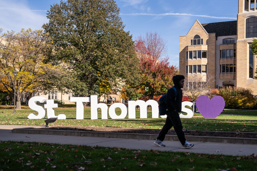 The St. Thomas letters standing up on the quad in the sun