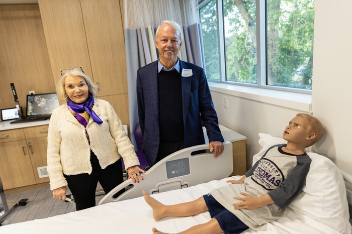 Susan and John Morrison in the Susan S. Morrison Learning and Simulation Lab looking at the new technology