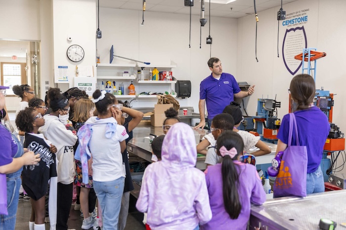 Maxfield Elementary students participate in Concrete Crushing with Travis Welt during their Summer to the Max campus visit in the Schoenecker Center on June 17, 2025, in St. Paul.