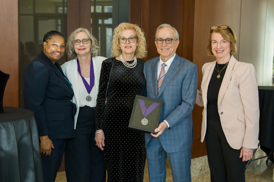 Dr. Lisa Abendroth, second from left, wears a medallion symbolizing her endowed position. With Abendroth, from right, is Dr. Janine Sanders Jones, associate dean and the Daniel and Ruth Haggerty Chair in Business Administration, benefactors Tami and Mike Hoffman and Dr. Laura Dunham, dean of the Opus College of Business. 