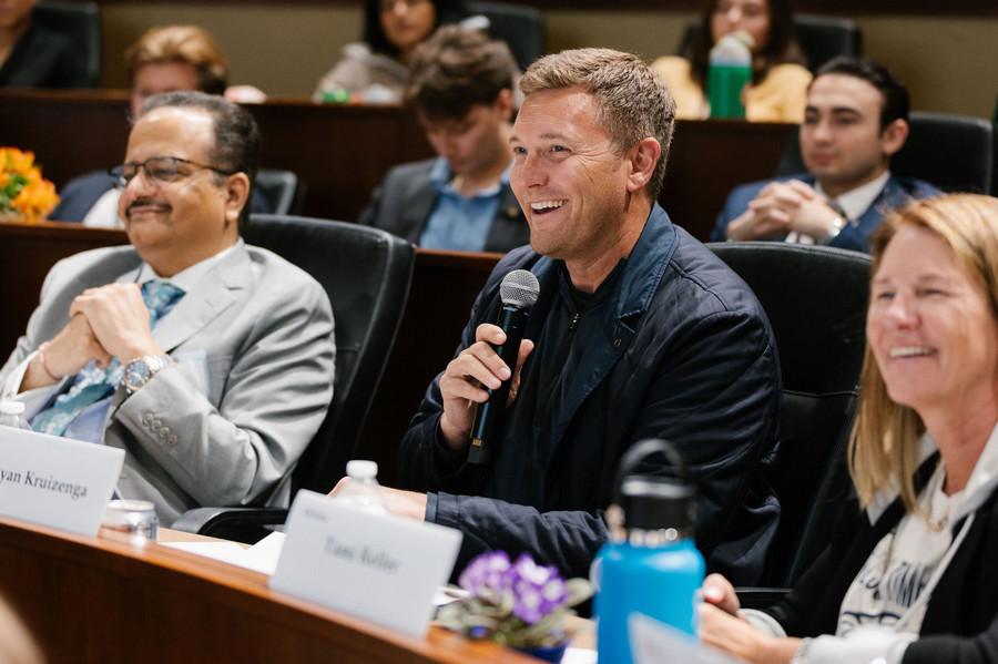 Ryan Kruizenga ’04, partner at Arthur Ventures and member of the St. Thomas Board of Trustees, asks a question during the championship round of business presentations at e-Fest in April 2026. 