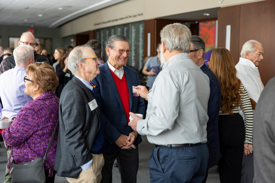 Tommies gathered at a networking event