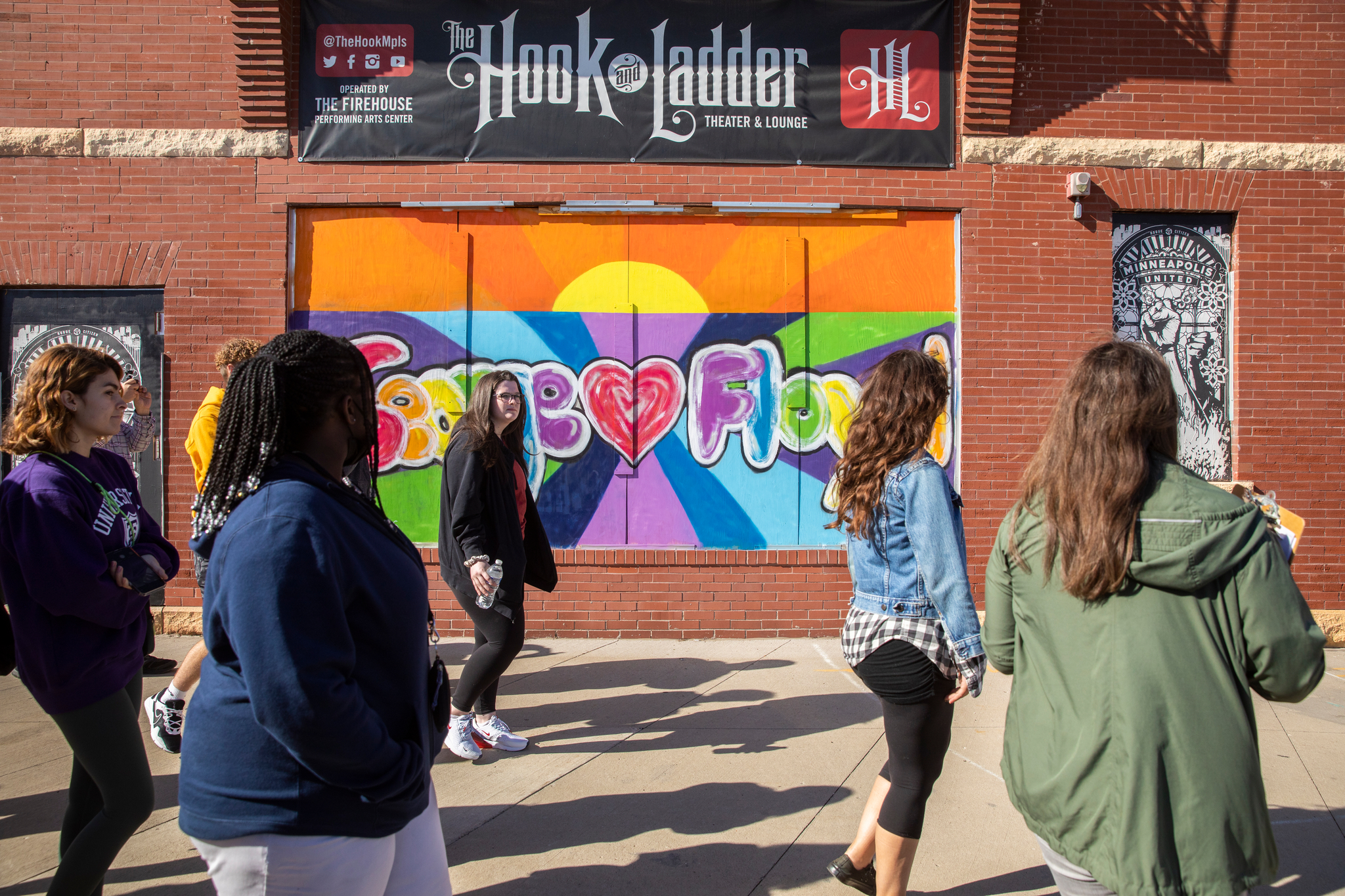 Students visit the site of the Minneapolis Police 3rd Precinct and surrounding area to observe and discuss the street art that has been made since the destructive protests that occurred there in May of 2020 following the murder of George Floyd