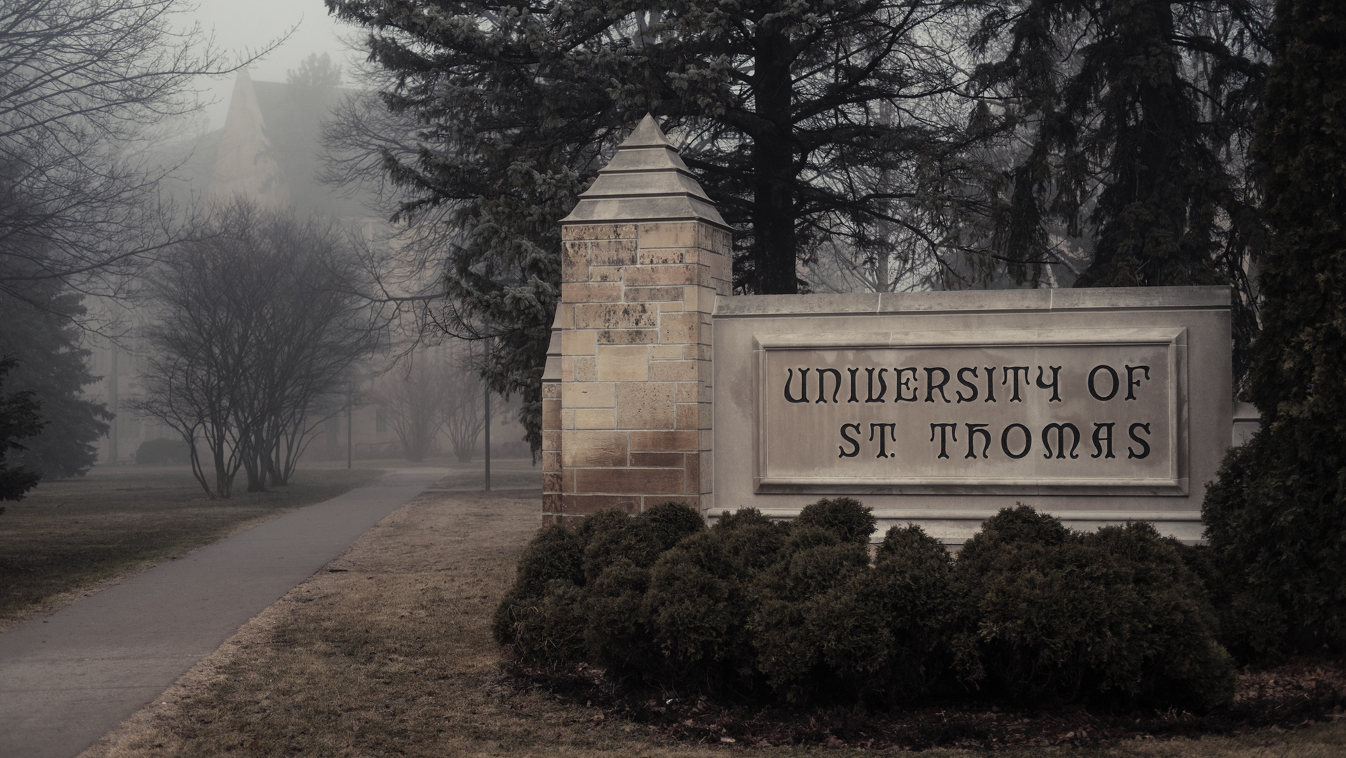 stone St. Thomas sign on the southeast end of campus