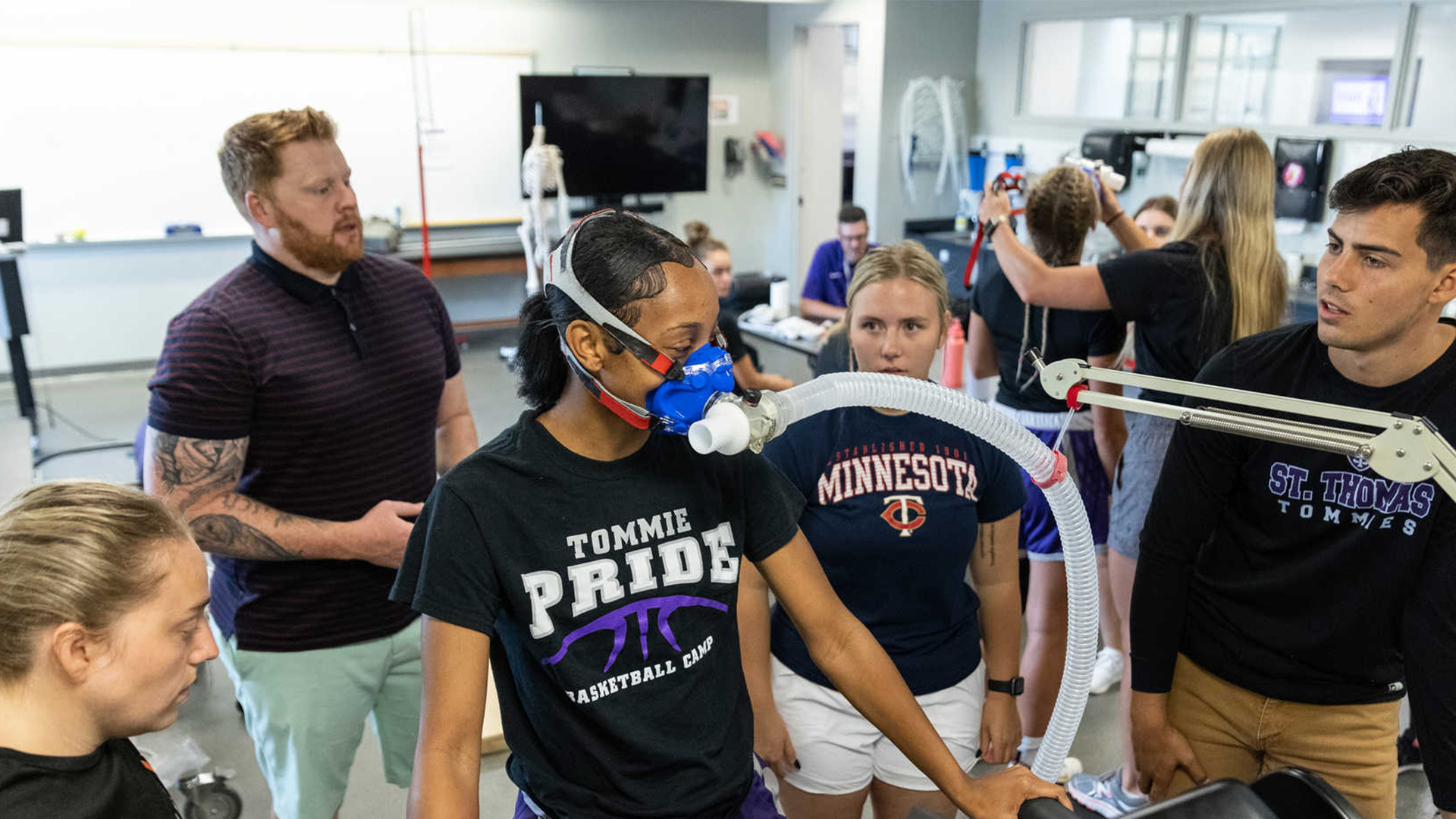 several people gathered around a VO2 test