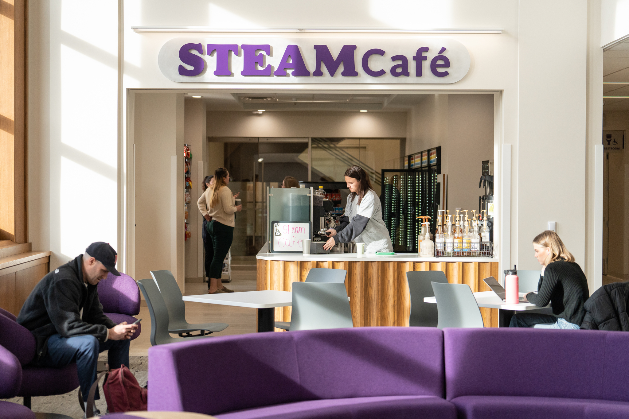 Students studying at the Steam Cafe on a sunny day
